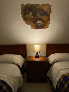 Postel nebo postele na pokoji v ubytování Posada Todos Santos