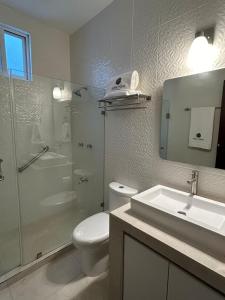 a bathroom with a toilet and a shower and a sink at Kobikhome in Cancún