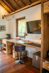 a room with a desk and a bed at Flow Gili Air in Gili Air
