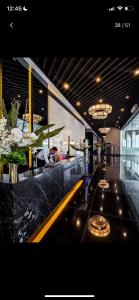 a lobby of a building with a bar with a counter at Air Residences in the Heart of Makati City - Great for Tourists, Staycations or Working Professionals in Manila