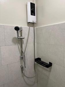 a shower in a bathroom with a shower at Victory Place in Bangkok +25 photos