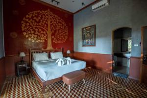 Postel nebo postele na pokoji v ubytování Sala Done Khone Hotel