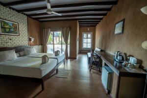 Postel nebo postele na pokoji v ubytování Sala Done Khone Hotel