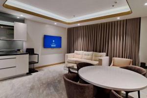 a living room with a couch and a table at One Euphoria 1 Bedroom 2mins to Walking Street & Restaurants in Angeles