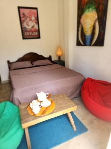 Postel nebo postele na pokoji v ubytování Hasthi homestay