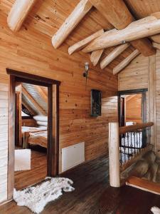 a log cabin with two bunk beds in it at Prosilva house in Topliţa