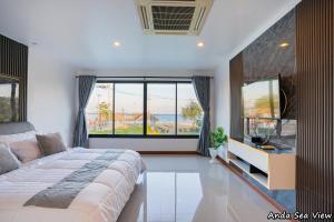 Ένα ή περισσότερα κρεβάτια σε δωμάτιο στο Anda Sea View Pranburi +29 φωτογραφίες