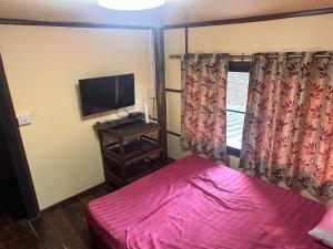 Postel nebo postele na pokoji v ubytování NADOHN2 Nai Fan Homestay + 17 fotografií