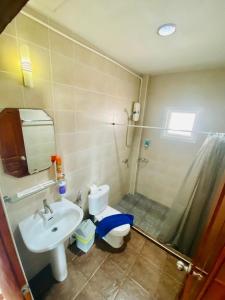 een badkamer met een wastafel, een toilet en een douche bij BT hotel Kata Beach in Kata Beach