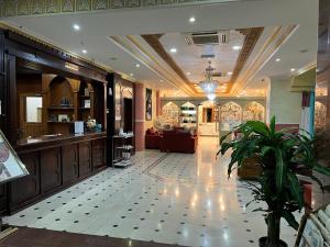 a lobby of a store with a potted plant at Safari Hotel in Nizwa