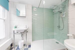 a bathroom with a shower and a sink at Northern Belle four Bedroom Apartment in Margate