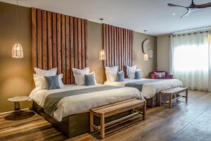 Säng eller sängar i ett rum på Nosy Manga - Hotel Ivato Airport