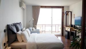 Una cama o camas en una habitación de il Piccolo Polpo Hotel