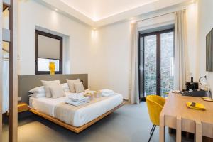 ETNEA Suite 270客房内的一张或多张床位