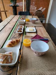 a wooden table with a tray of food on it at L'eau douce in Gasques