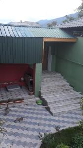 a patio of a house with a roof at Gabala House in Gabala