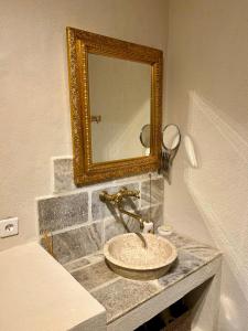 a bathroom with a sink and a mirror at notre dame des anges in Lurs