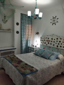 Postel nebo postele na pokoji v ubytování La Casa de La Abuela Rosy
