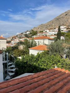 a view of a city from the roofs of buildings at Piteoussa Plus Hydra in Hydra