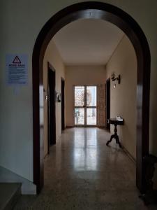 an empty hallway with a piano in a building at EEM student Guest House (shared rooms) in Is-Swieqi