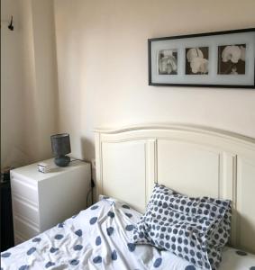a bedroom with a bed and a picture on the wall at Cielo Azul in Campoamor +20 photos