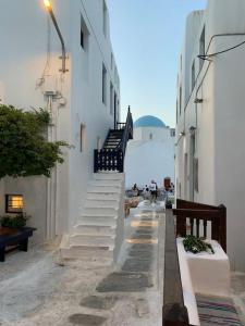 a group of stairs leading up to a building at Traditional apartment in the heart of Mykonos! in Mikonos