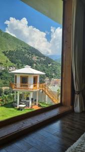 a view of a house from a window at The Swat House in Swat