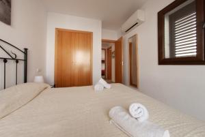 Łóżko lub łóżka w pokoju w obiekcie Casa de 5 habitaciones en Cala D'or