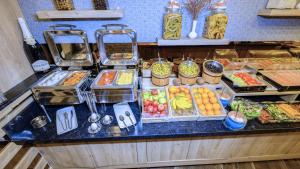 a buffet with different types of food on a counter at Mai İnci Otel in Antalya