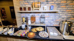 a counter with many different types of food on it at Mai İnci Otel in Antalya