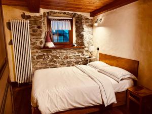 מיטה או מיטות בחדר ב-Maison Bovet Mont Blanc