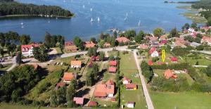 an aerial view of a small town next to the water at Lawendowy Domek Mazury in Rydzewo