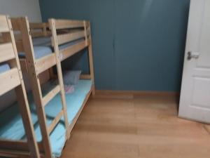a room with two bunk beds and a door at Global Guest Rooms in Sintra