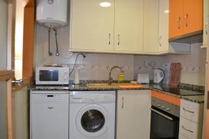 Kuchnia lub aneks kuchenny w obiekcie Sant Pere 139 Apartments