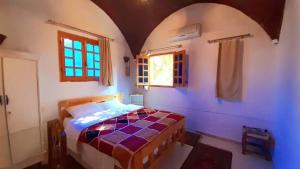 a bedroom with a bed and a window at Nobian House Studios #2 in Luxor