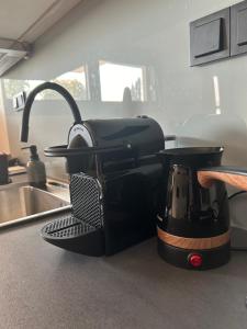 a coffee maker sitting on a counter in a kitchen at Hilltop house in Ioannina