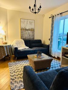 a living room with a couch and a table at The Waterside B&B in Westport