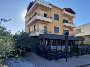 a building with a fence in front of it at Vila Bakri Couple Room in Elbasan