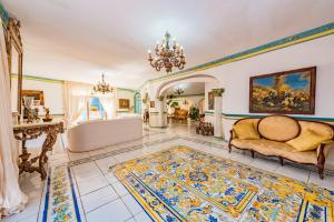 an ornate living room with a chandelier at Villa Costa degli Dei in Furore