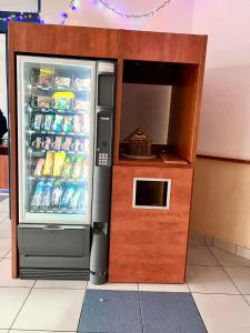 a refrigerator with a small house inside of it at Bizzhotel in Szczecin