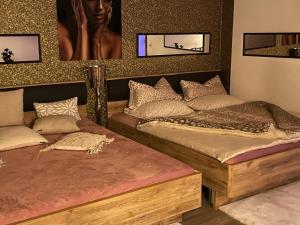 En eller flere senger på et rom på Escape Private SPA I