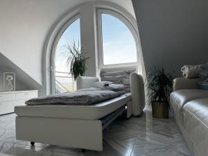 a bed sitting in a room with a window at Traumurlaub im Schwarzwald in Dornstetten