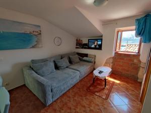 a living room with a couch and a table at Margarita in Baška