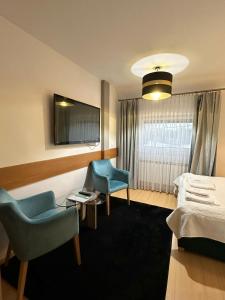 Łóżko lub łóżka w pokoju w obiekcie Motel Za Miedzą
