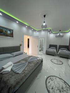 a large bedroom with a large bed and a couch at HOTEL Casa Vacanze SHIROKE in Shkodër
