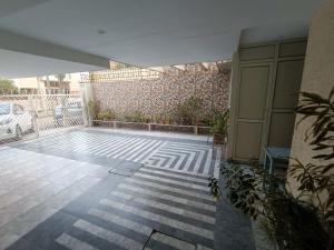 an empty patio with plants on a building at snooze 3 in Panchkula