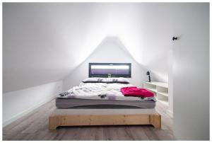 a bedroom with a bed in a attic at Świętokrzyskie Zacisze in Wołów +19 photos