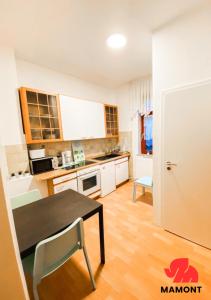 a kitchen with a table and a dining room at Ganze Monteurwohnung zum Entspannen in Bremen