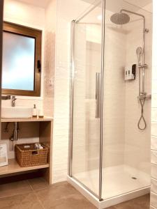 a bathroom with a shower and a sink at Casinhas da Póvoa- Turismo Natureza in Castelo de Vide +54 photos