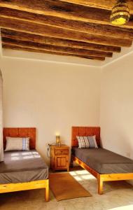 Postel nebo postele na pokoji v ubytování Maison de Vacances "Dar Khalifa"